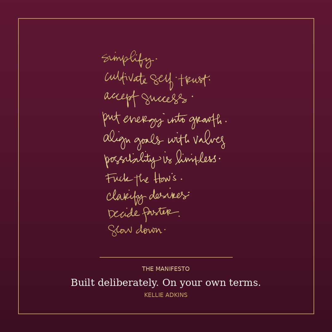 The Manifesto poster: ten handwritten lines, gilded on a wine background.